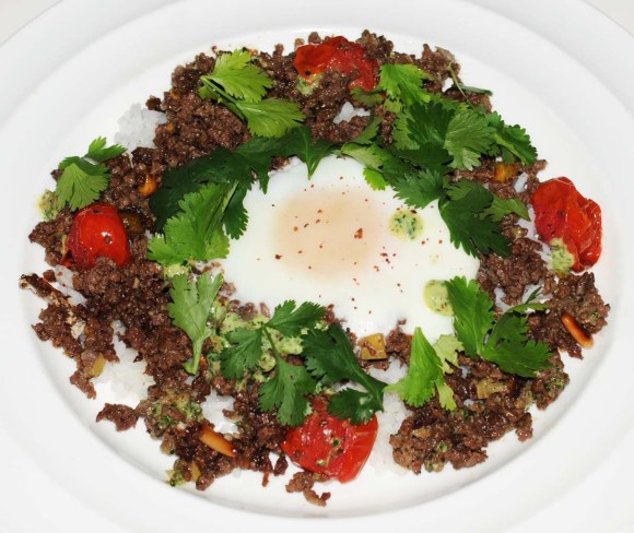 Lamb mince with baked egg, sumace and harissa